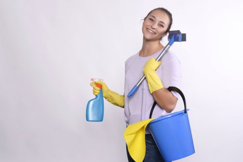 Cleaning operative wearing PPE during carpet care